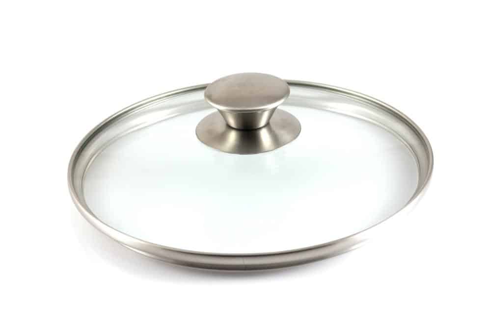 Photo of a glass lid with a stainless steel knob