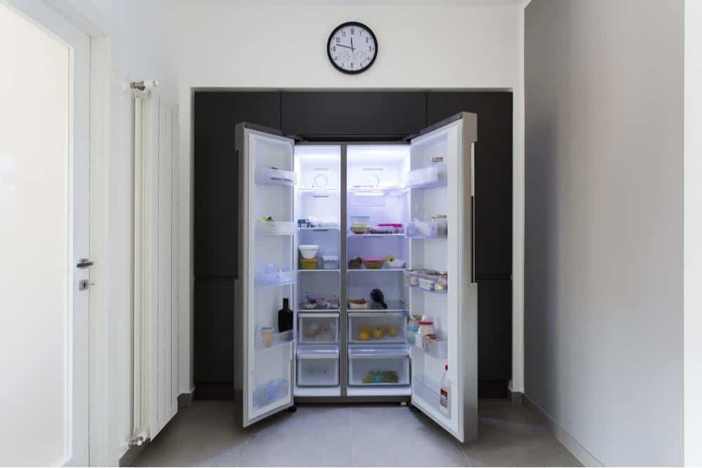 Photo of an open side by side refrigerator