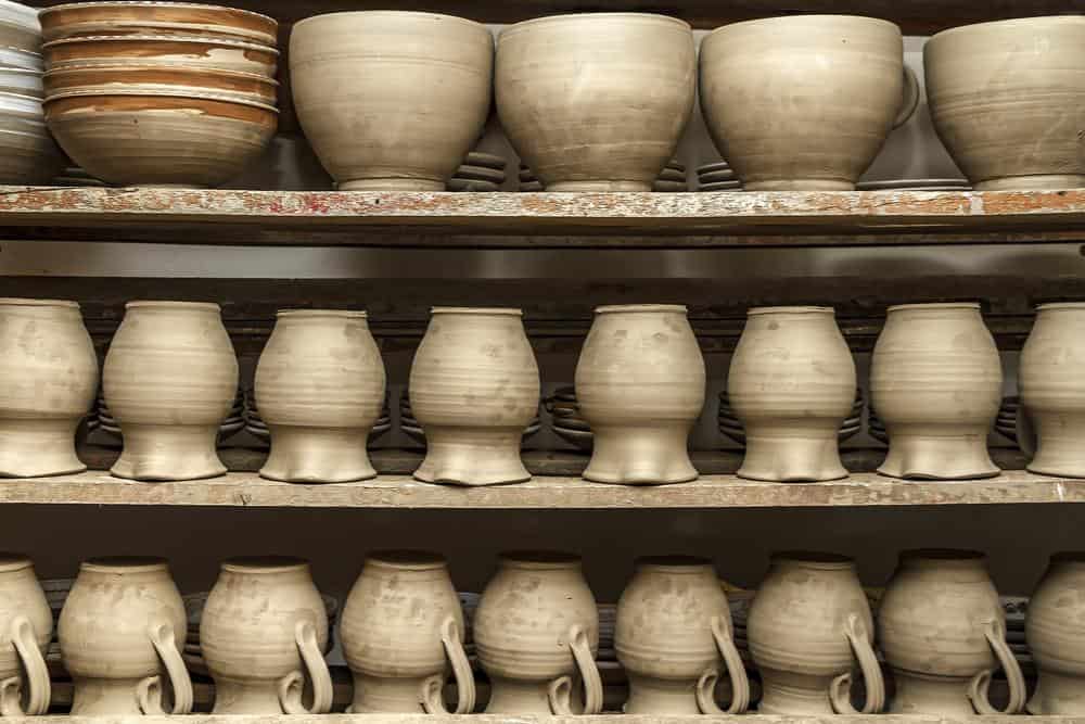 Photo of clay objects sitting on a shelf