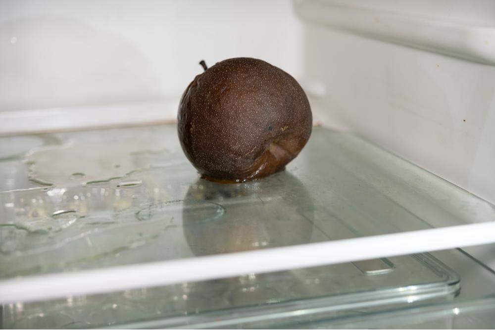 Photo of unidentified fruit rotting in refrigerator