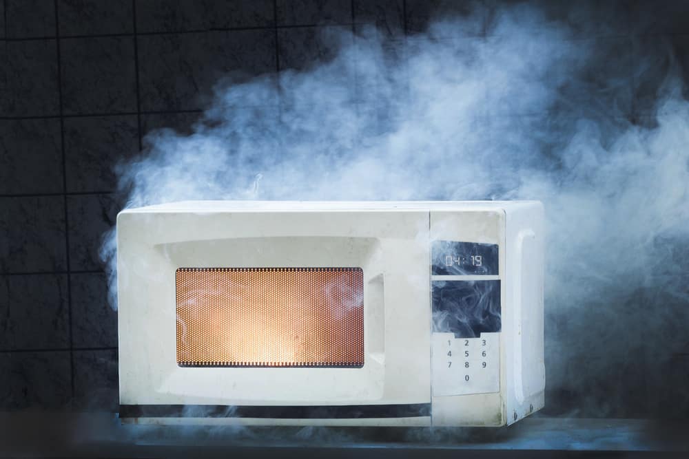Photo of a microwave on fire