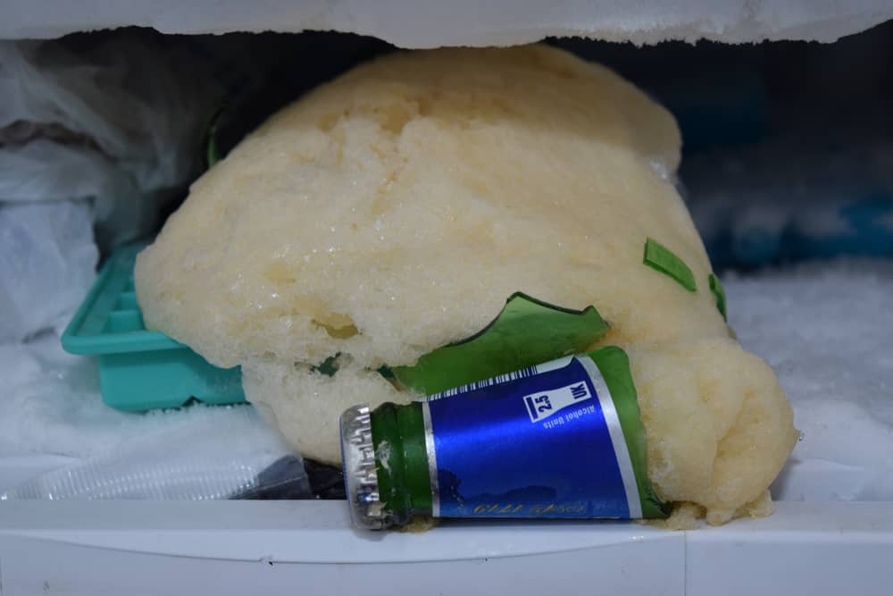 Photo of an exploded beer bottle in a freezer