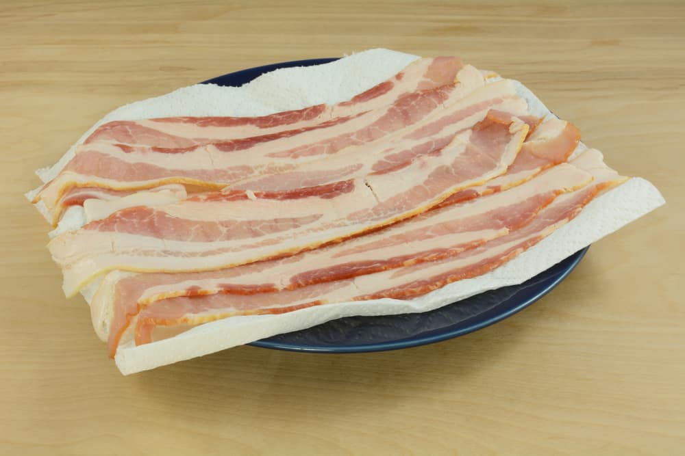 Photo of raw bacon ready for the microwave