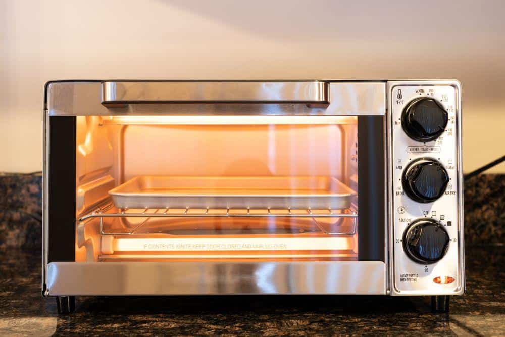 A Toaster Oven Illuminated by Heating Elements