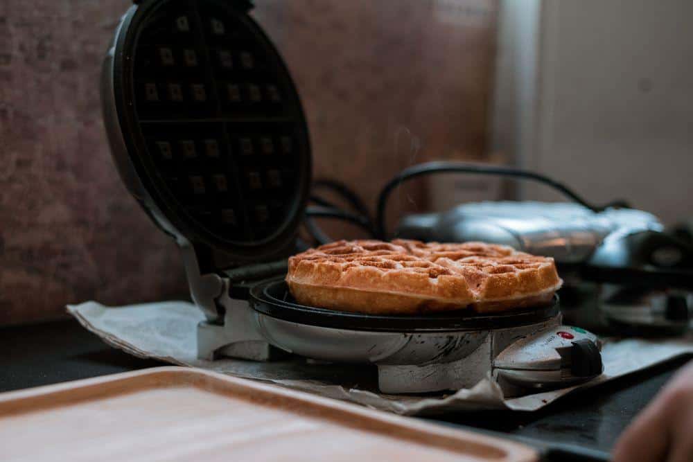 Photo of a Finished Golden Brown Waffle in a Wafflemaker