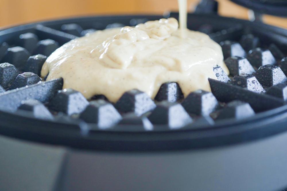 Photo of Pancake Batter Poured on a Waffle Maker