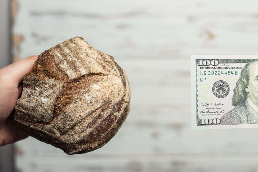 Photo of Someone Paying For Bread