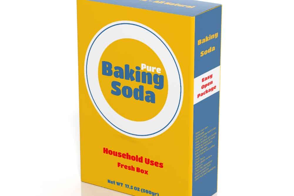 A box of baking soda on a white background helps to eliminate chemicals and unpleasant tastes in fridge.