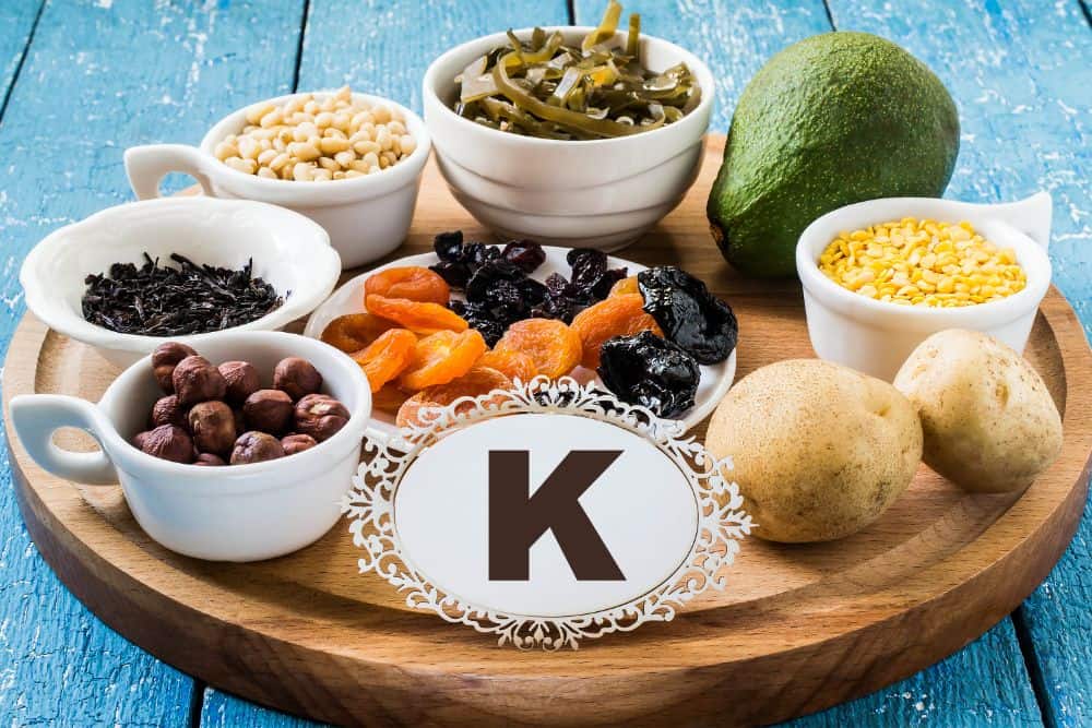 A plate of soft foods with the letter k on it.